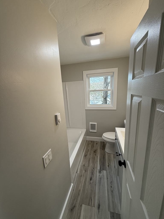 12 Hunnewell Road, Unit 2R Worcester, MA 01606 - Photo 6 of 13 a spacious bathroom with sink toilet and a window