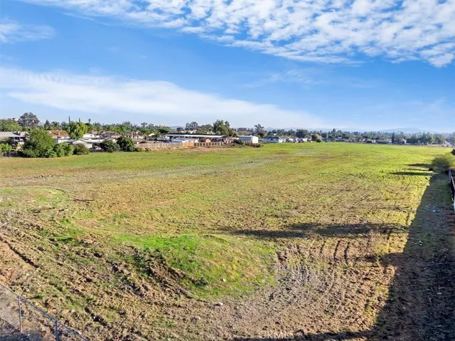 a view of a swimming pool with a table and chairs