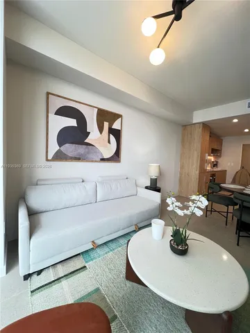 a living room with furniture and window