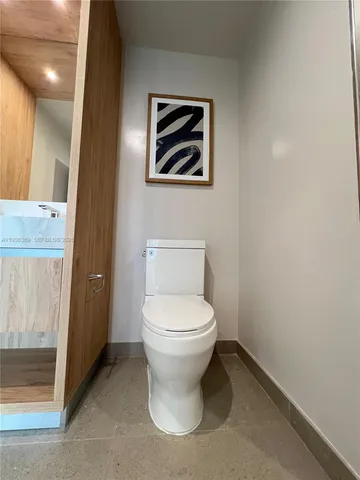 a bathroom with a toilet and a sink