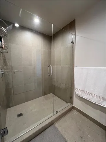 a bathroom with a shower and a bathtub