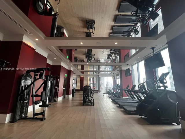 a living room with couch and large window