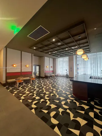 a kitchen with a table chairs and a stove