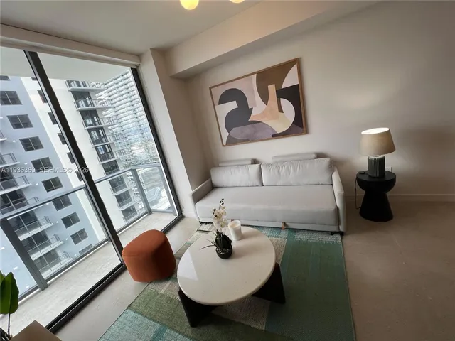 a bathroom with a bathtub and a mirror