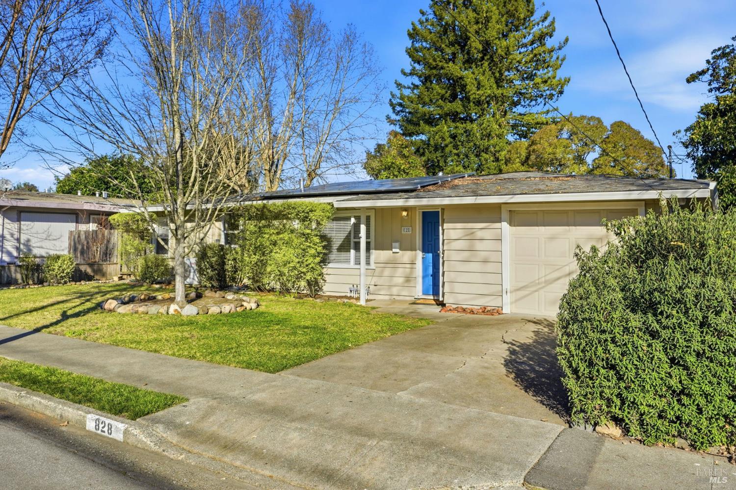 front view of a house with a yard