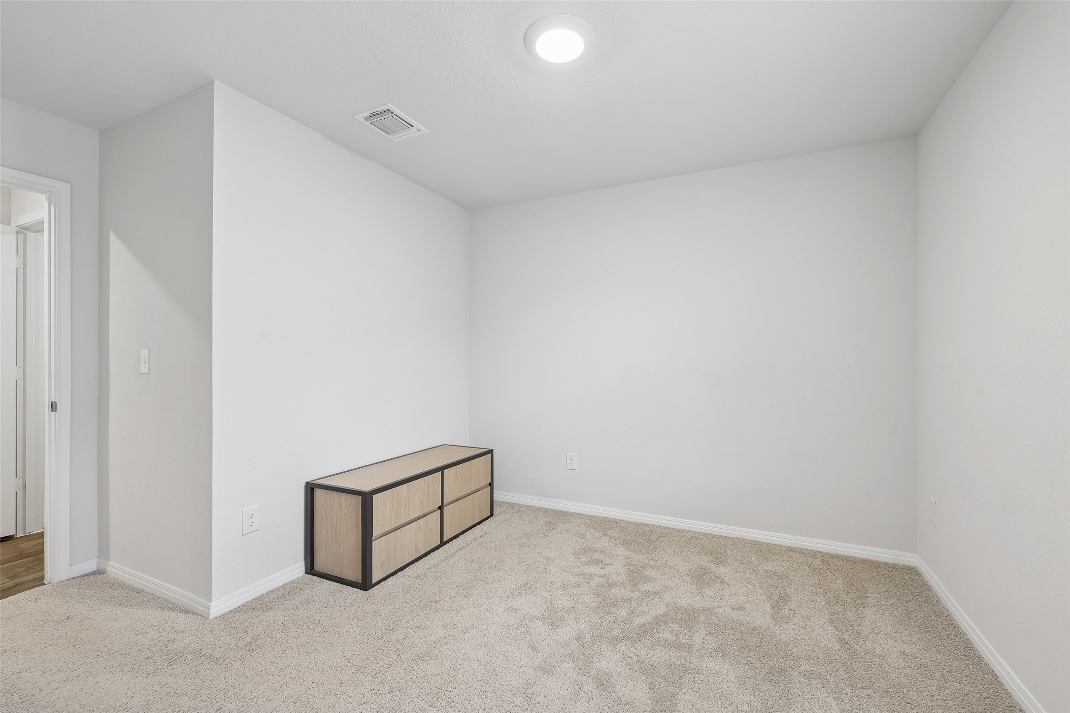 19805 Abigail Fillmore Road Manor, TX 78653 - Photo 25 of 40 A spacious room presents a versatile layout for a home office or guest bedroom.