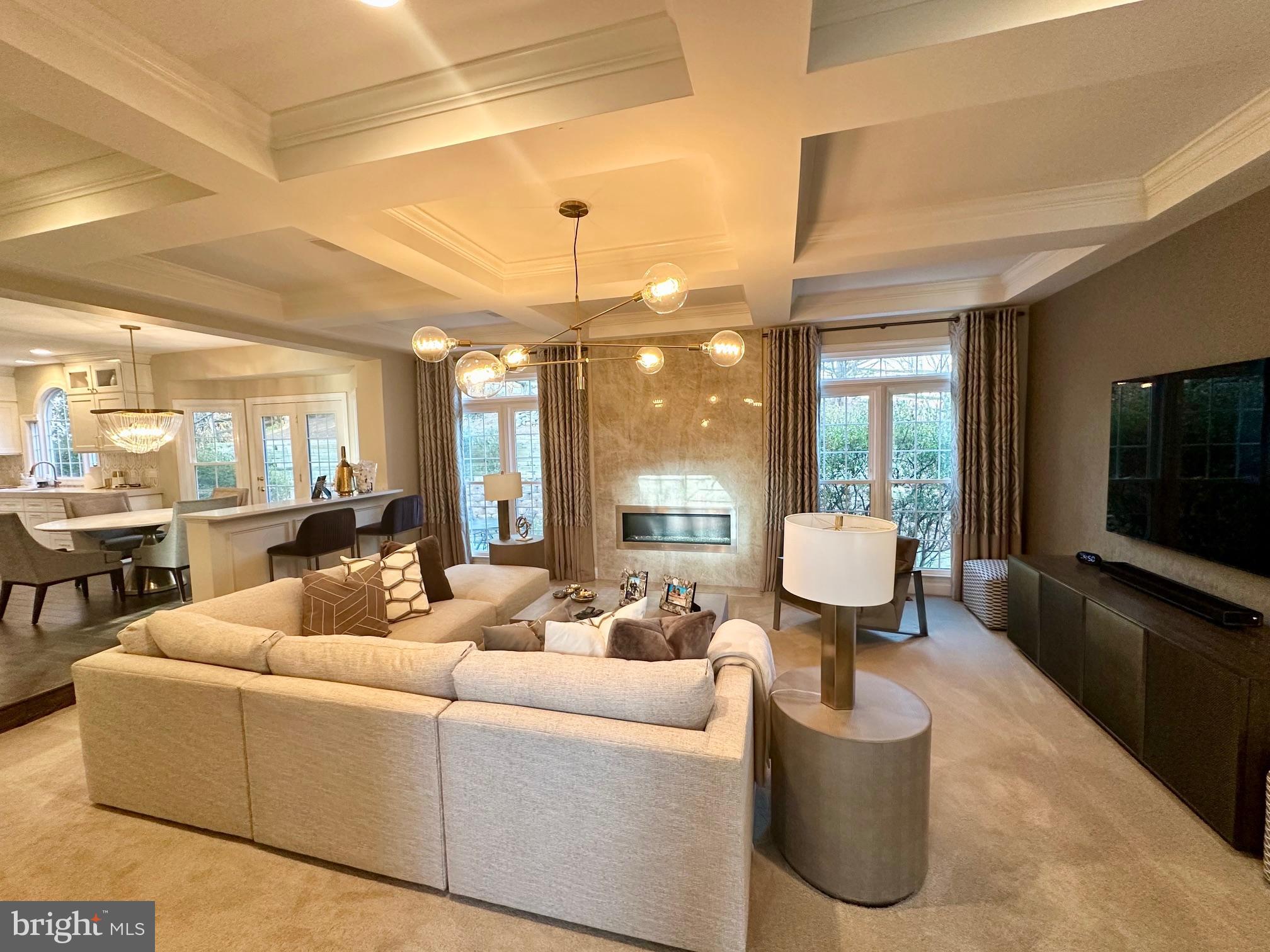 13701 Goosefoot Terrace Rockville, MD 20850 - Photo 7 of 16 a living room with furniture and a flat screen tv