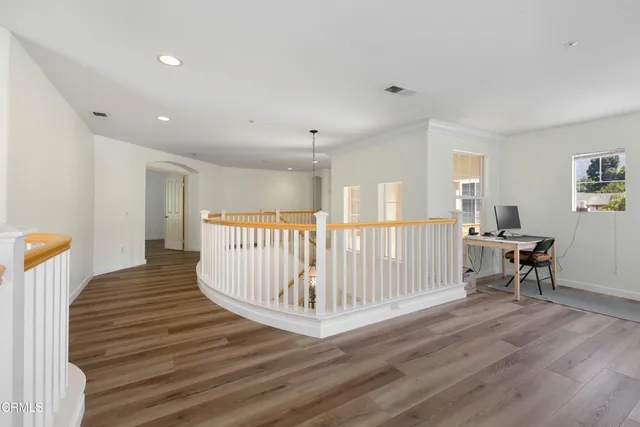 a view of entryway with wooden floor