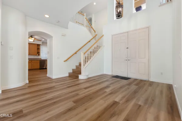a view of an entryway with wooden floor