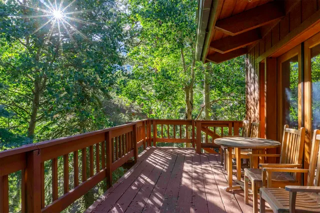 a view of a balcony with furniture