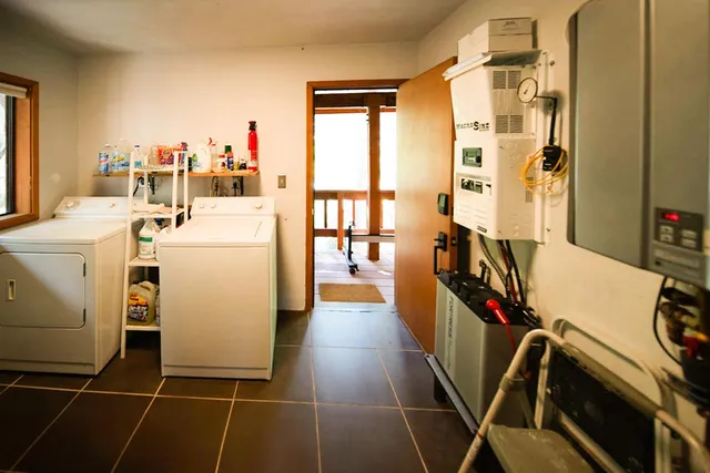 a view of a storage & utility room with washer and dryer