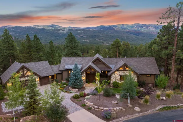 a view of a house with a mountain in the background