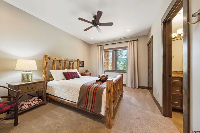 a bed room with a bed and a window