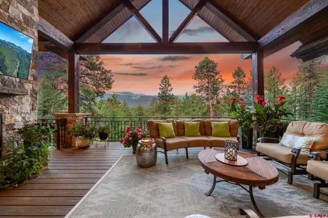 a outdoor space with chairs and a potted plant