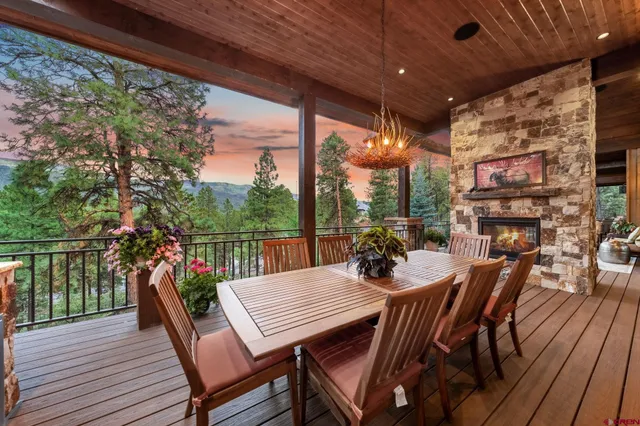 a outdoor dining space with furniture and wooden floor