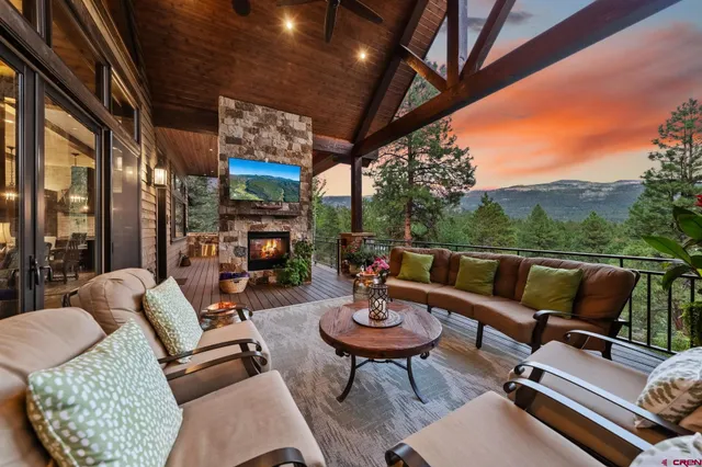 a outdoor living space with furniture and a fireplace