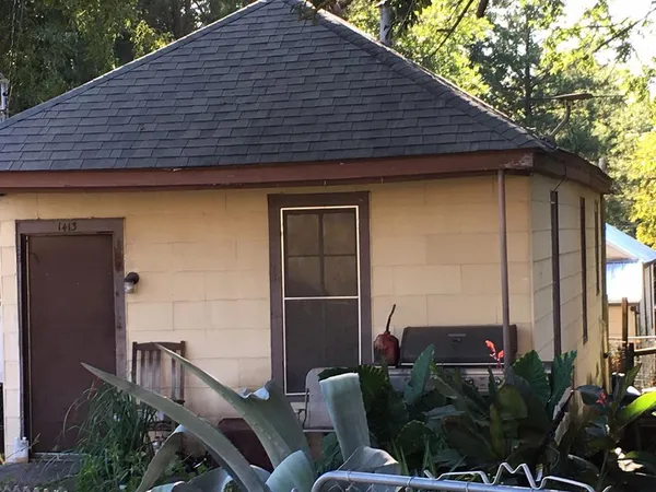 a backyard of a house with seating space