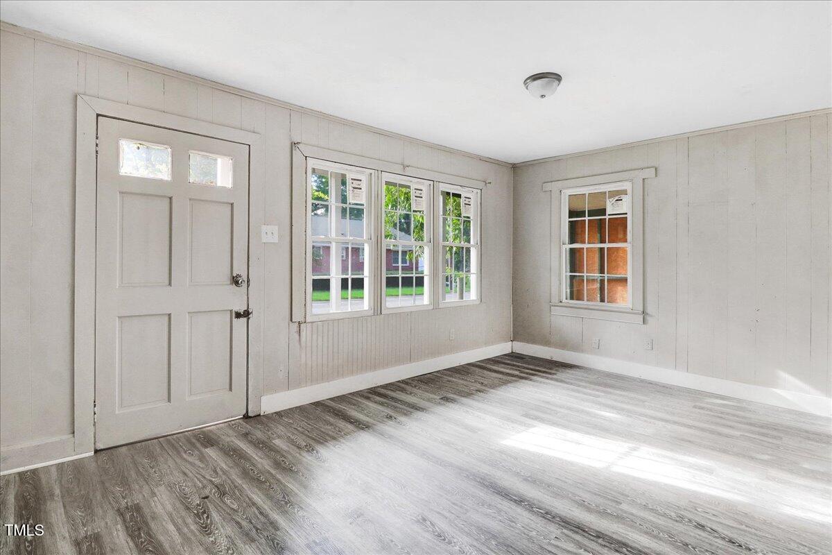 201 East Hooks River Road Goldsboro, NC 27530 - Photo 5 of 16 a view of an empty room with wooden floor and a window