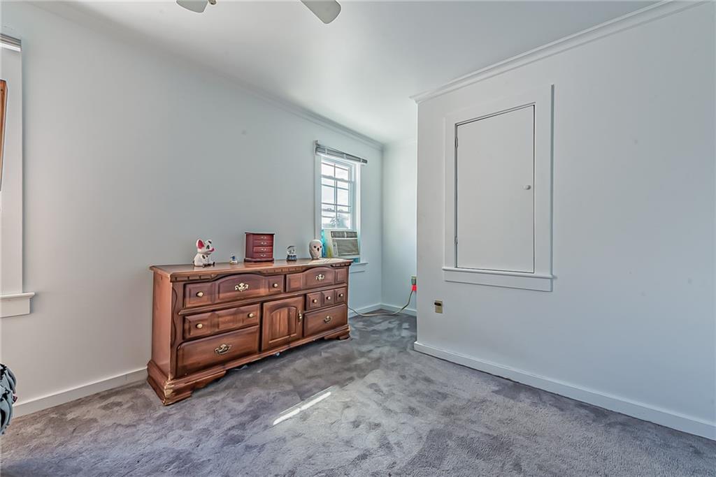 118 Ave A Latrobe, PA 15650 - Photo 13 of 25 a room with a bed and a mirror