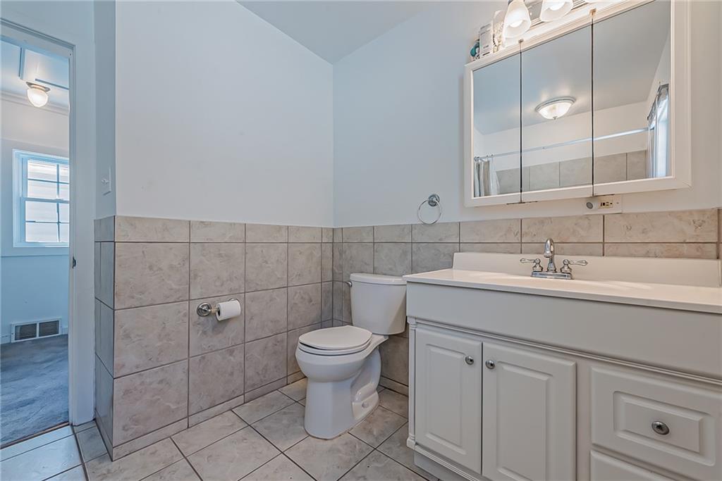 118 Ave A Latrobe, PA 15650 - Photo 16 of 25 a bathroom with a sink toilet and shower