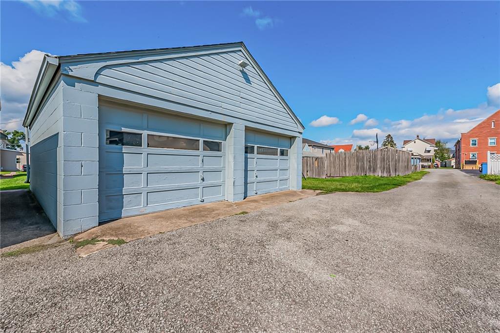 118 Ave A Latrobe, PA 15650 - Photo 22 of 25 a view of a house with a yard and garage