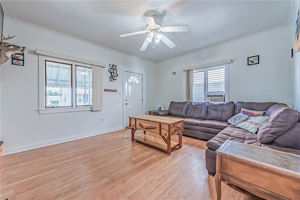 118 Ave A Latrobe, PA 15650 - Photo 4 of 25 a living room with furniture and a chandelier