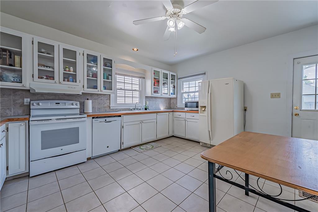 118 Ave A Latrobe, PA 15650 - Photo 5 of 25 a kitchen with a stove a sink and a refrigerator