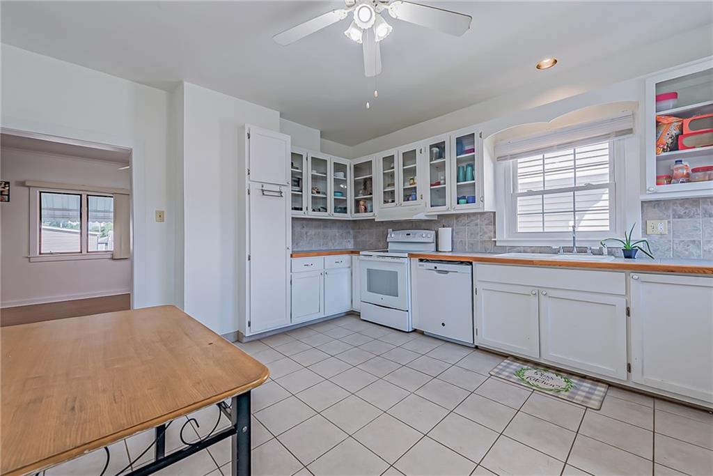118 Ave A Latrobe, PA 15650 - Photo 6 of 25 a kitchen with a sink cabinets and window