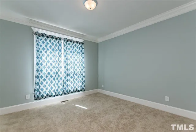 a view of a livingroom with a ceiling fan and window