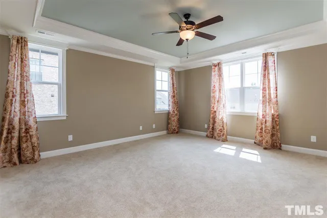 a bathroom with a bathtub a double vanity sink and mirror