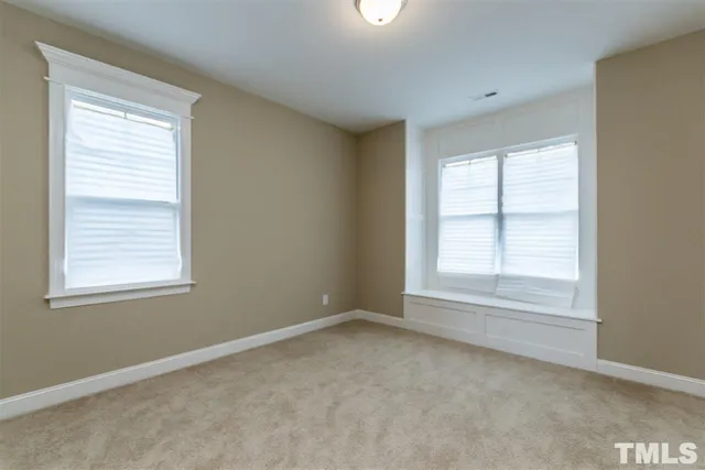 a bathroom with a granite countertop sink double and mirror