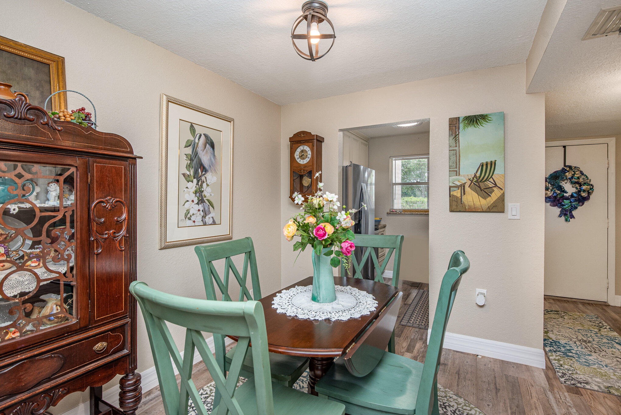 2450 Lake Washington Road, Unit 7A Melbourne, FL 32935 - Photo 13 of 24 a view of a dining room with furniture and wooden floor