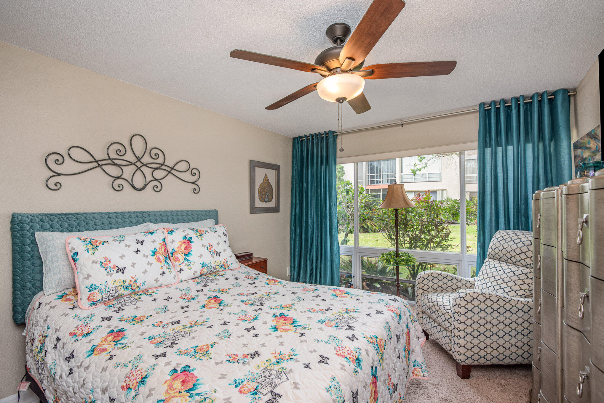 2450 Lake Washington Road, Unit 7A Melbourne, FL 32935 - Photo 14 of 24 a bedroom with a bed and a large window