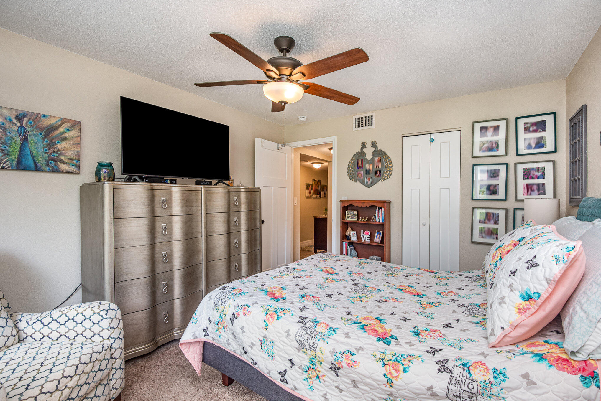 2450 Lake Washington Road, Unit 7A Melbourne, FL 32935 - Photo 16 of 24 a bedroom with a bed and a flat screen tv