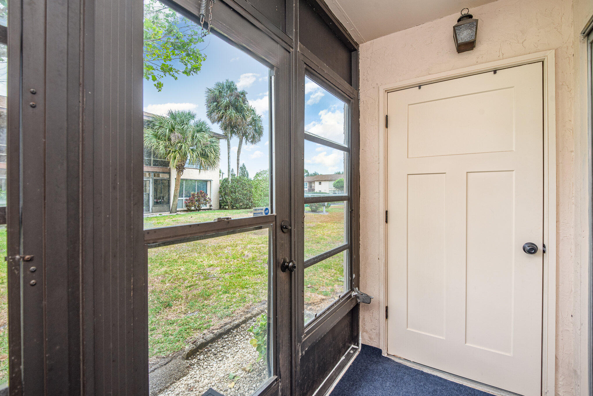 2450 Lake Washington Road, Unit 7A Melbourne, FL 32935 - Photo 19 of 24 a view of front door with wooden floor