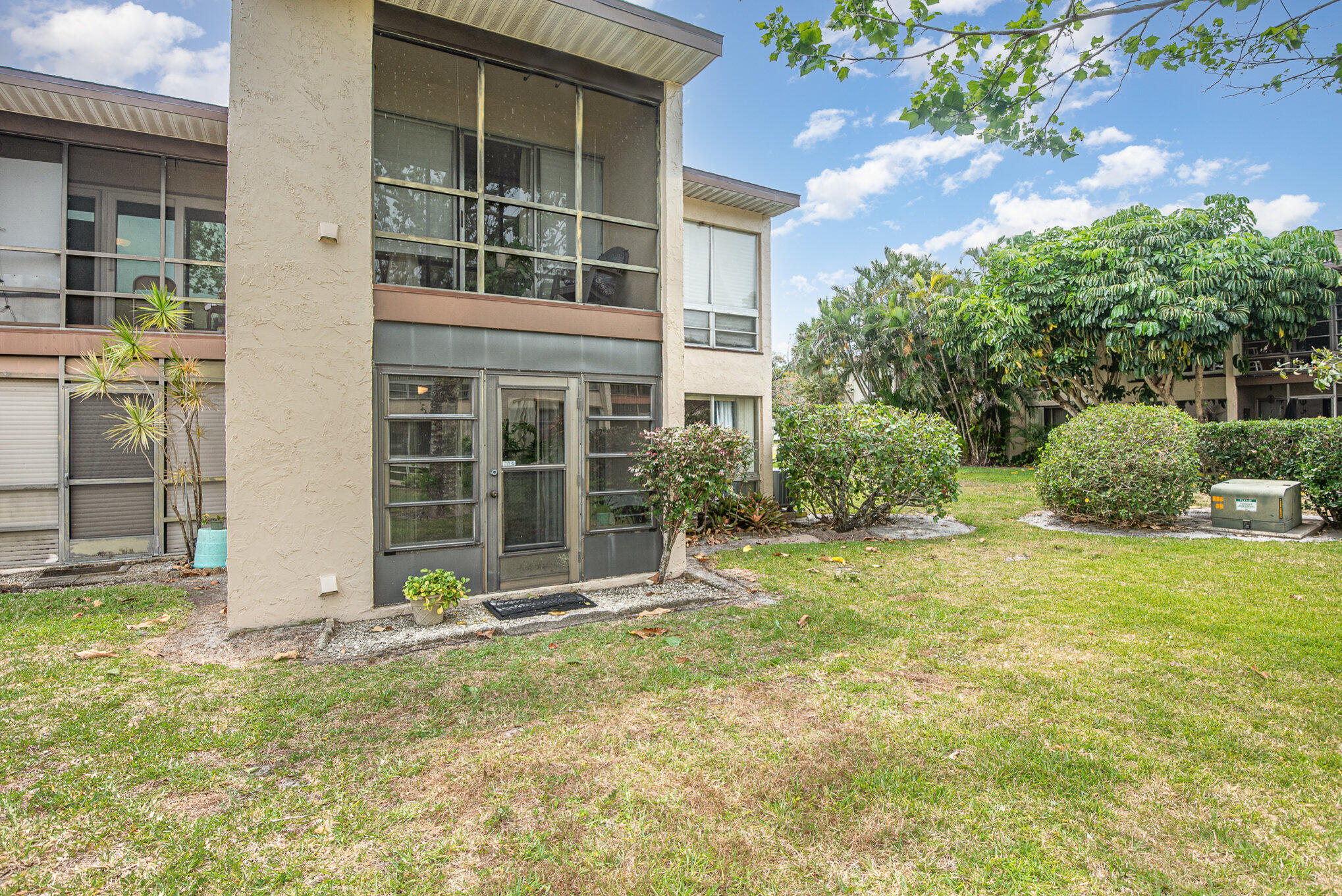2450 Lake Washington Road, Unit 7A Melbourne, FL 32935 - Photo 21 of 24 a front view of a house with a yard