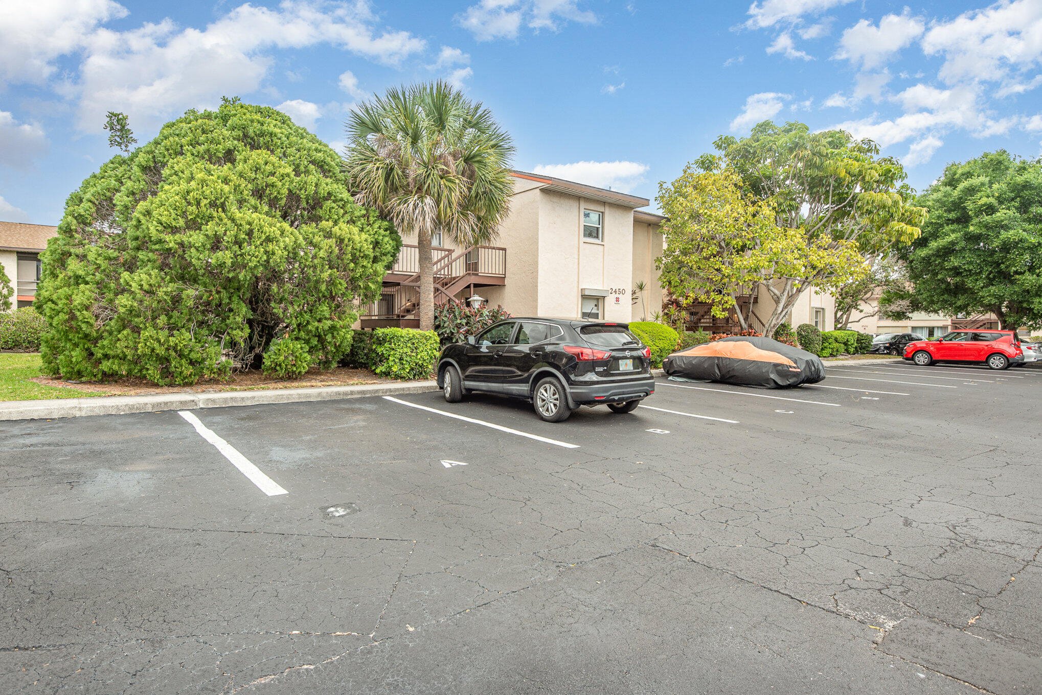 2450 Lake Washington Road, Unit 7A Melbourne, FL 32935 - Photo 24 of 24 a cars parked in front of a house