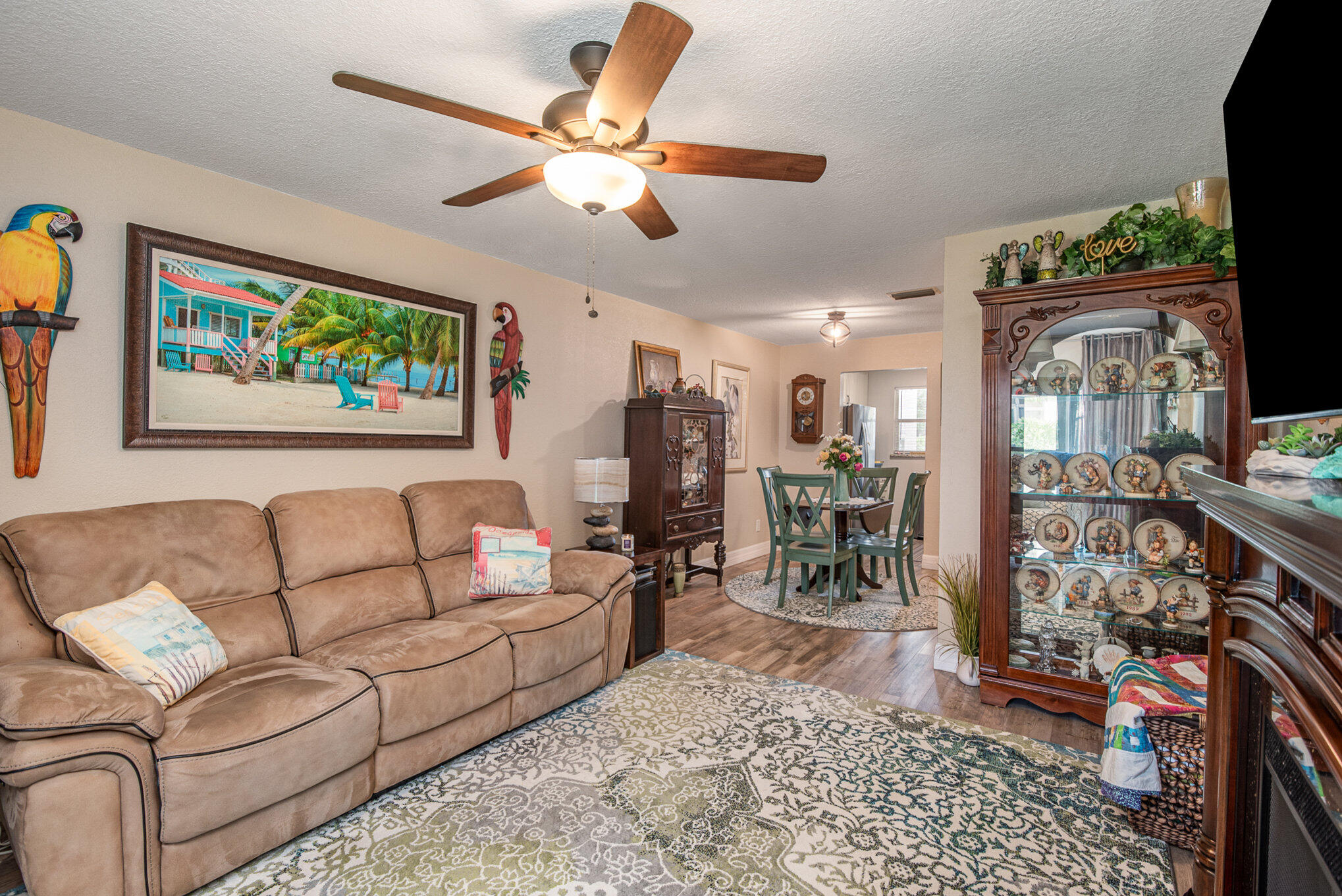 2450 Lake Washington Road, Unit 7A Melbourne, FL 32935 - Photo 4 of 24 a living room with furniture and a flat screen tv