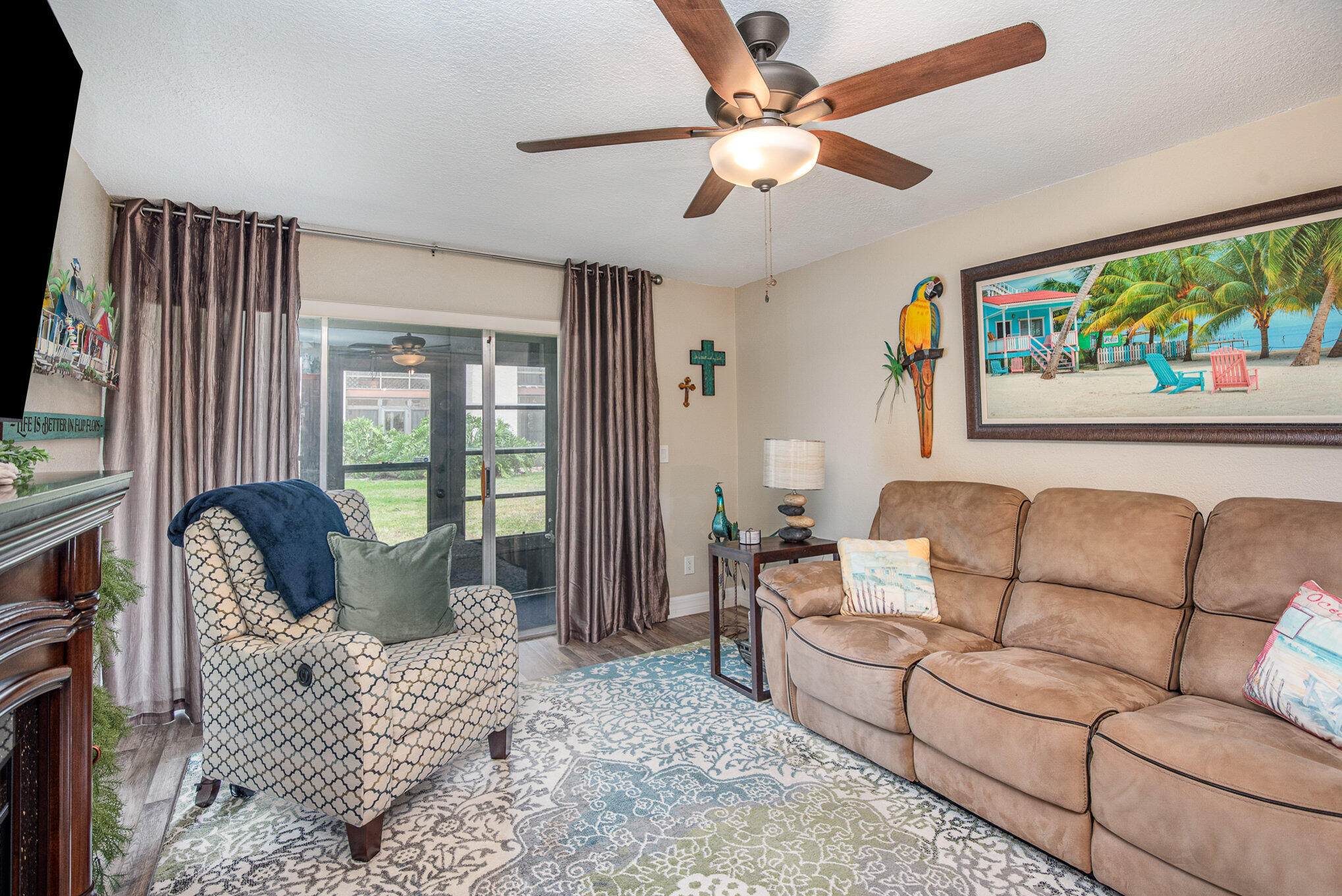 2450 Lake Washington Road, Unit 7A Melbourne, FL 32935 - Photo 10 of 24 a living room with furniture and a flat screen tv