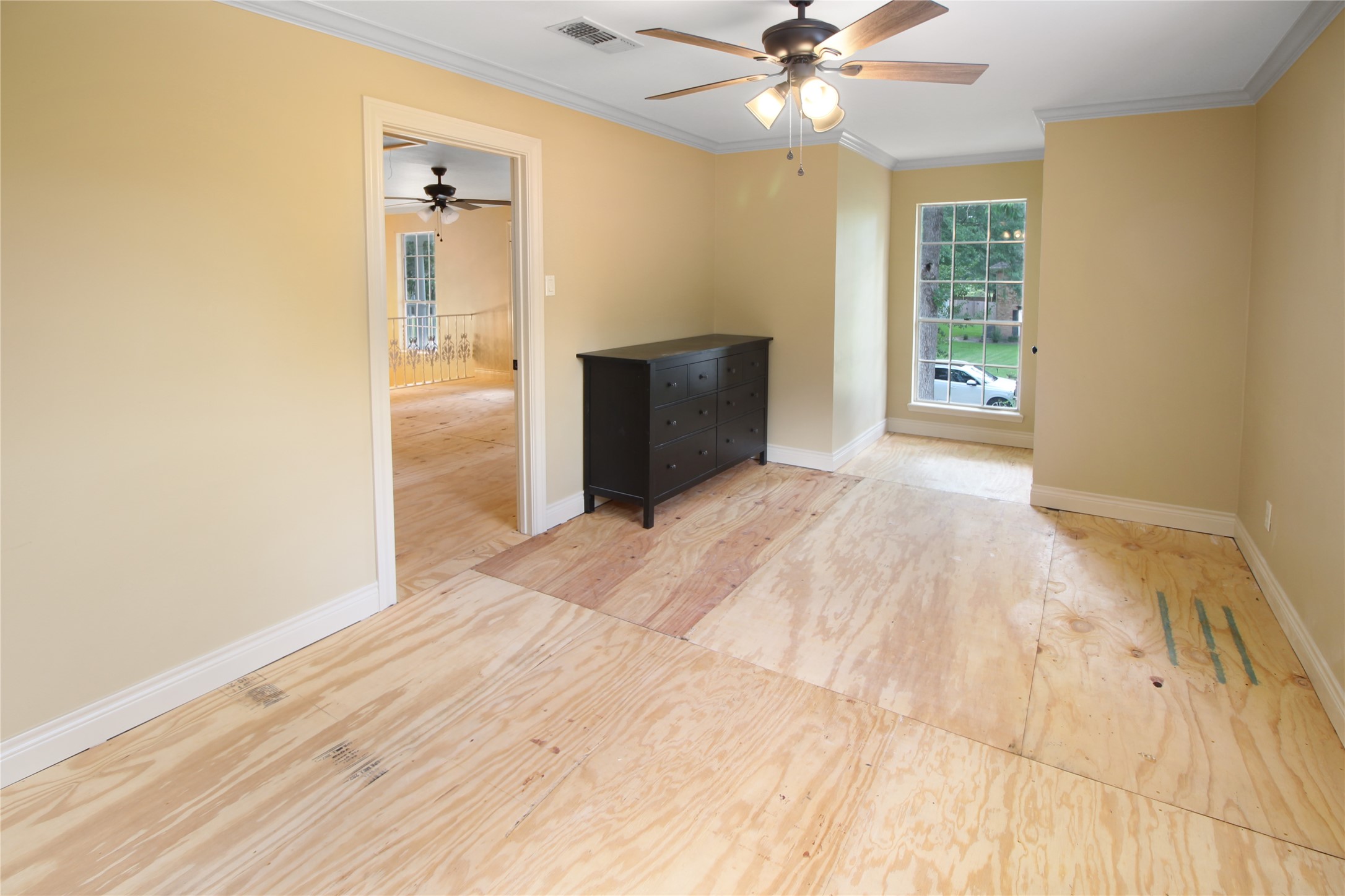 7531 Ralick Court Spring, TX 77379 - Photo 17 of 42 a view of an empty room with window and wooden floor