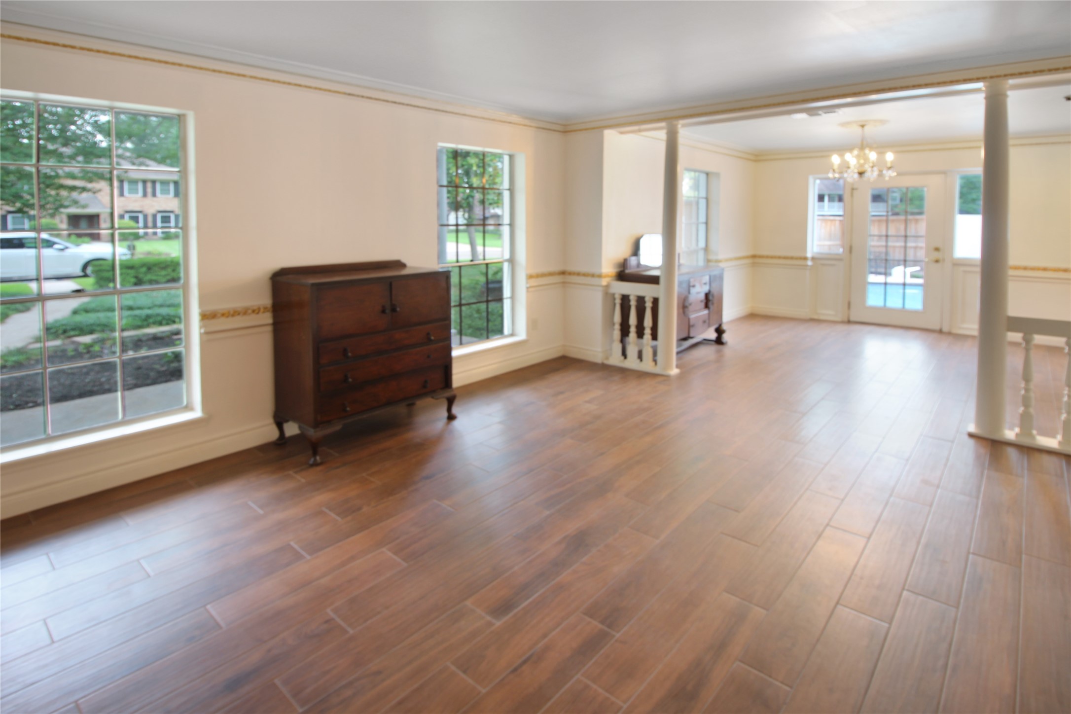 7531 Ralick Court Spring, TX 77379 - Photo 30 of 42 a view of an empty room with wooden floor and a window