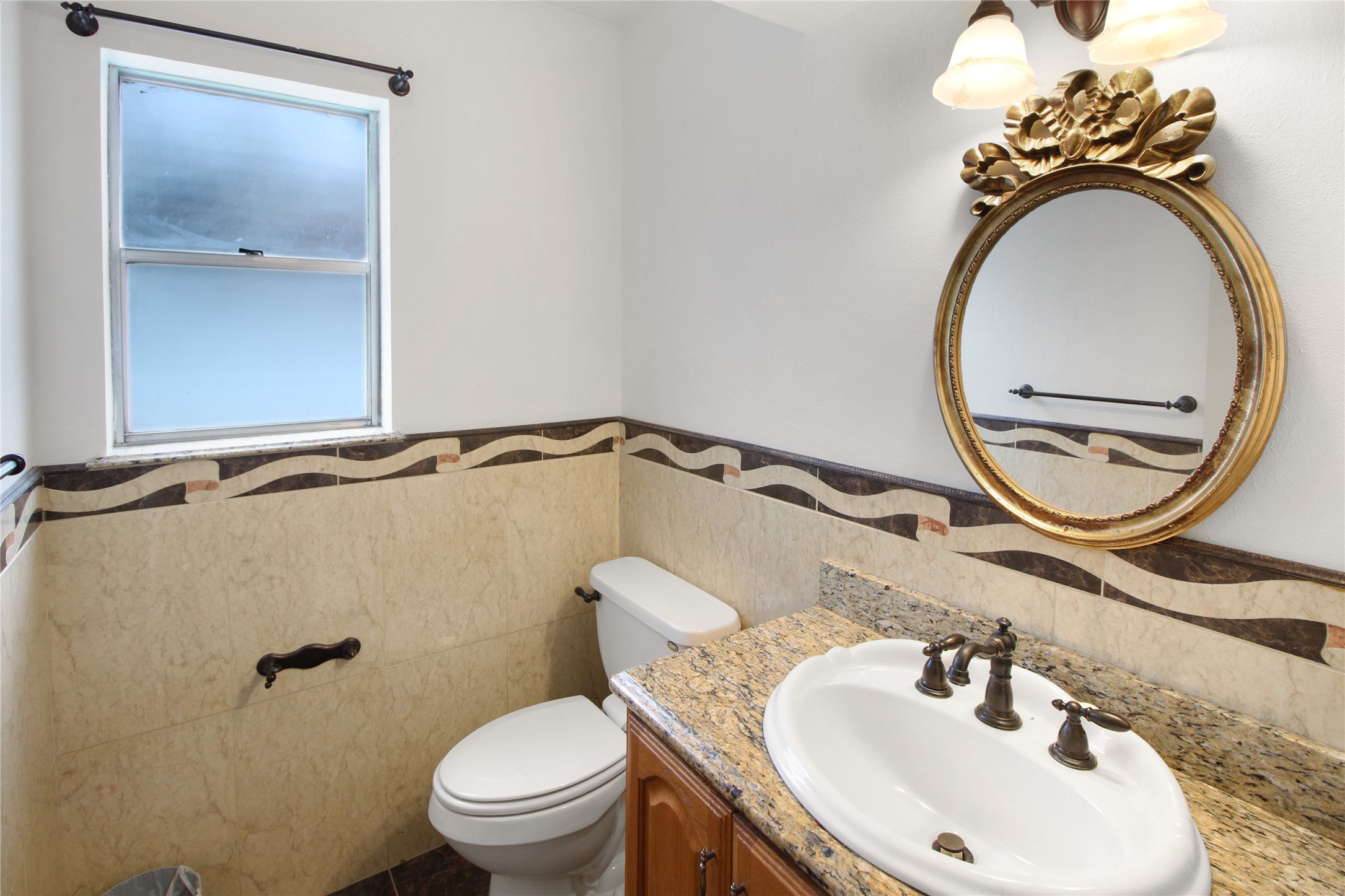 7531 Ralick Court Spring, TX 77379 - Photo 32 of 42 a bathroom with a sink and a mirror