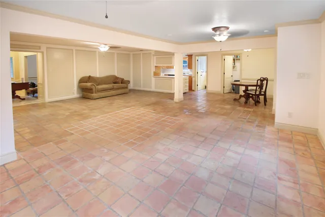 a view of a livingroom with furniture and a bathroom