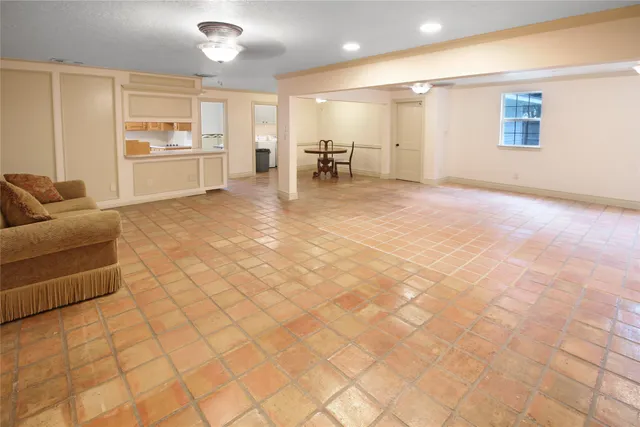 a large room with a couch and a view of living room