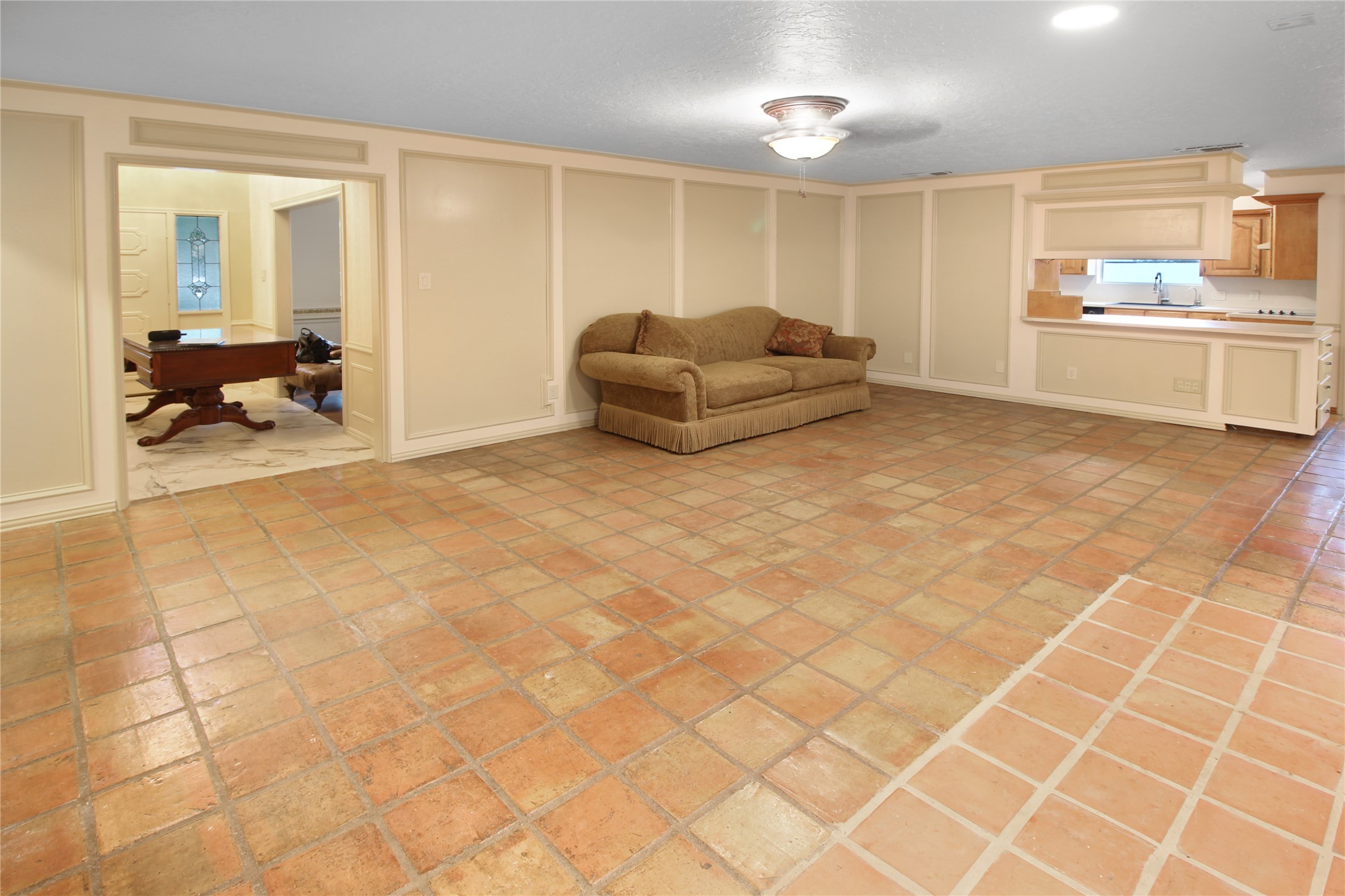 7531 Ralick Court Spring, TX 77379 - Photo 37 of 42 a living room with a couch and a stove top oven