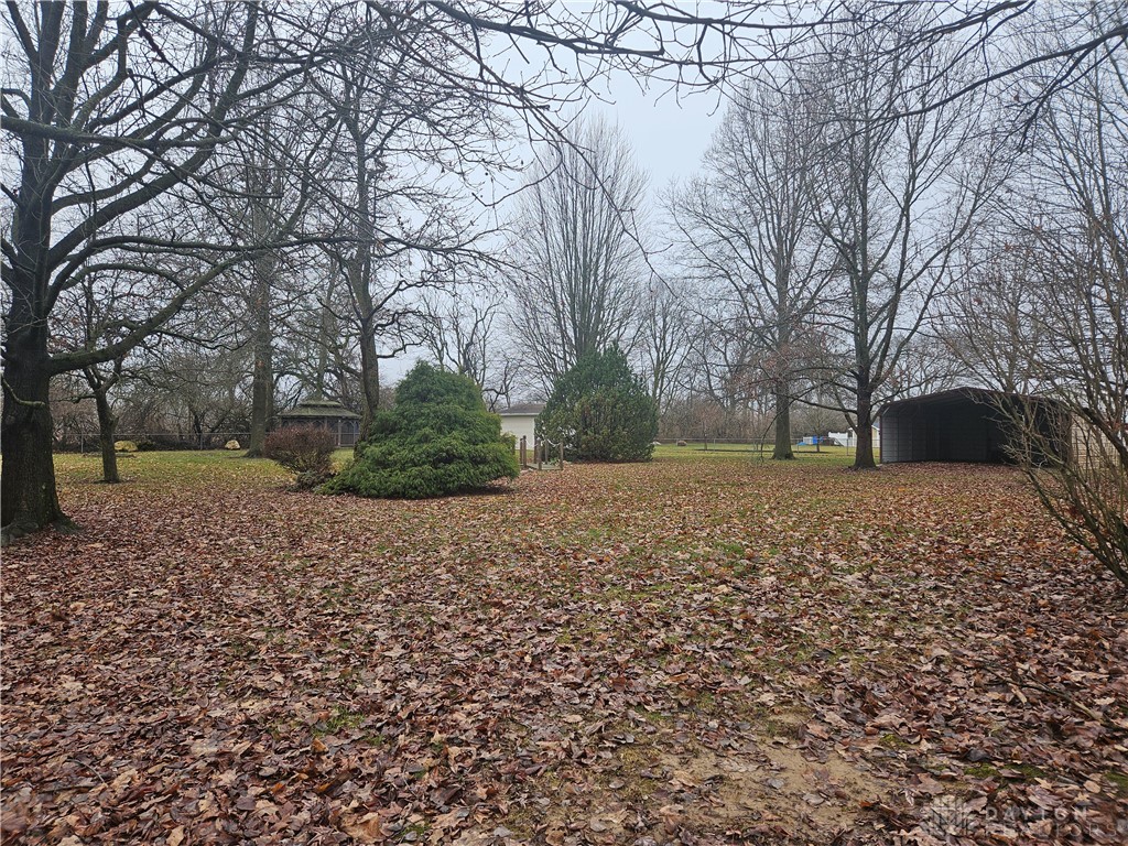 4909 Shannon Avenue Springfield, OH 45504 - Photo 17 of 21 Expansive yard with mature trees and a tranquil gazebo, offering abundant outdoor living.