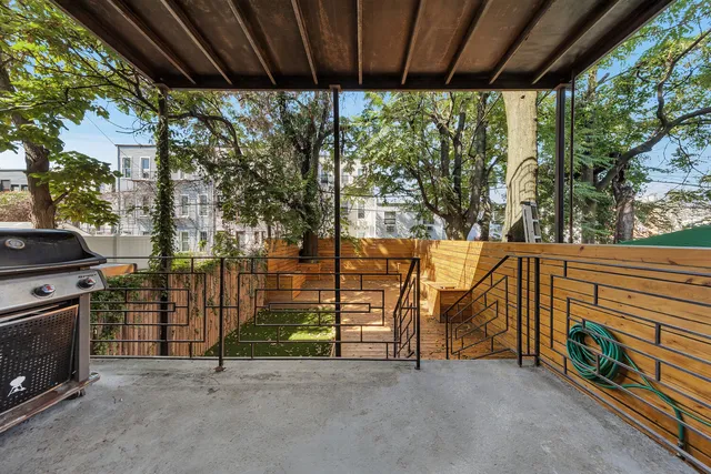 a patio with table and chairs