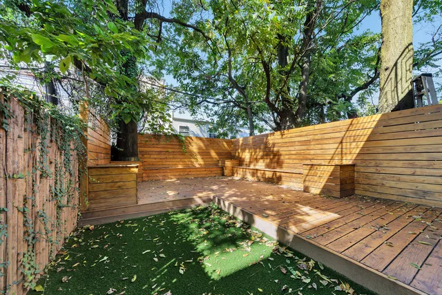 a view of a backyard with sitting area