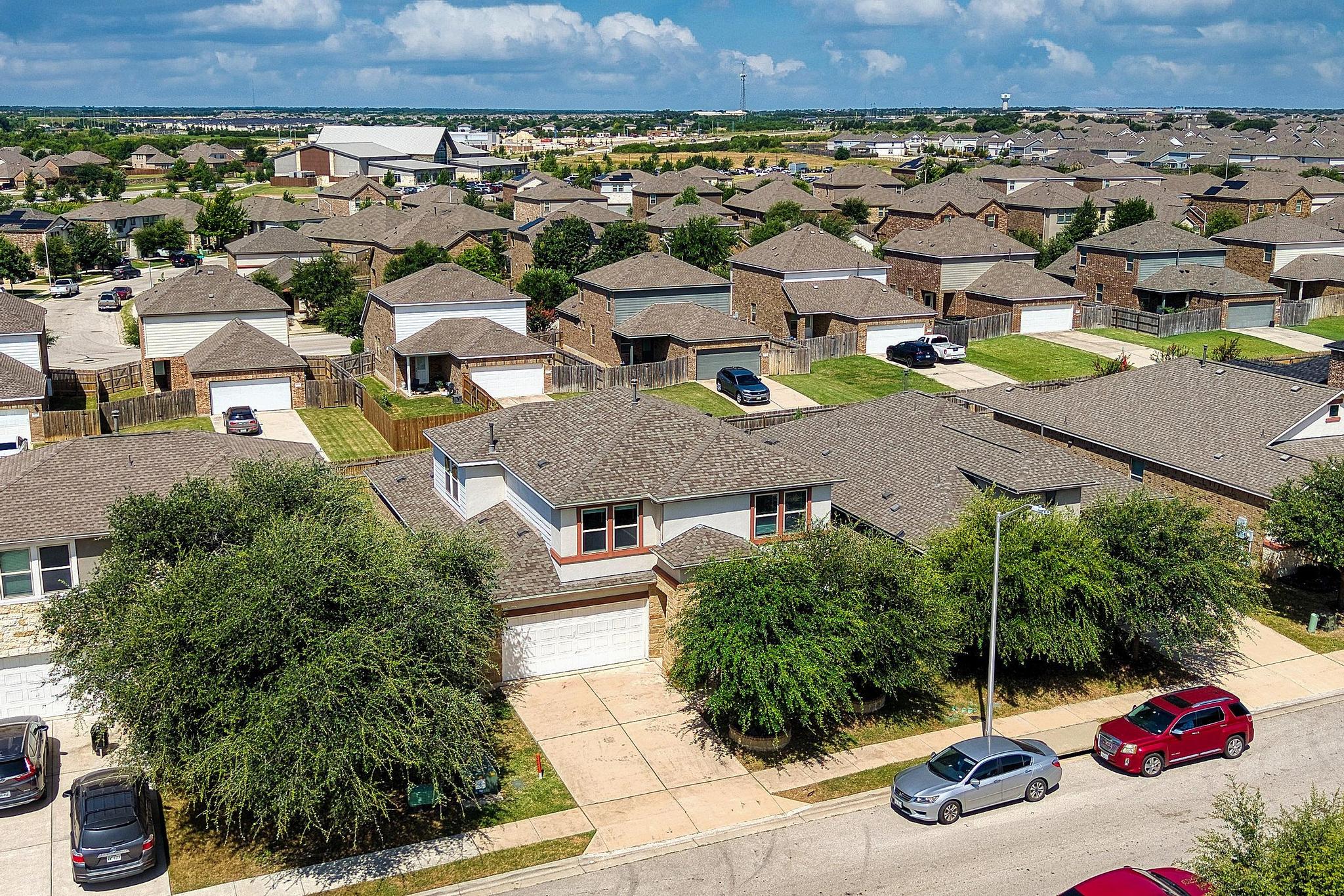 1341 Eagle Ray Street Leander, TX 78641 - Photo 28 of 37 An aerial perspective reveals a well-established neighborhood with ample green space and a consistent architectural style.