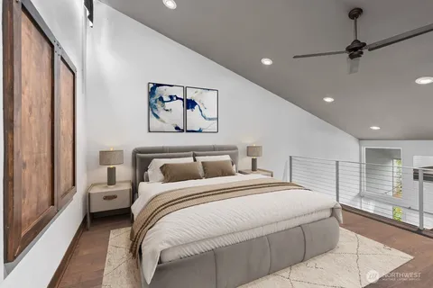 a bedroom with a large bed and a large window